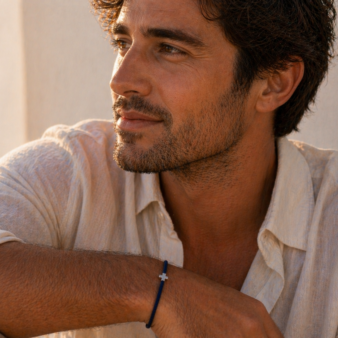 Man wearing a white shirt with a neutral background and Knotted Bracelet with Tiny Cross