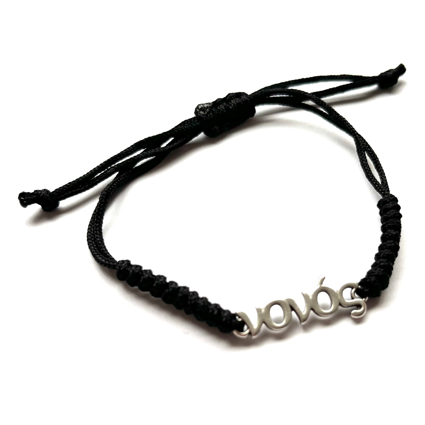 Black braided bracelet with a silver 'νονός' charm on a white background