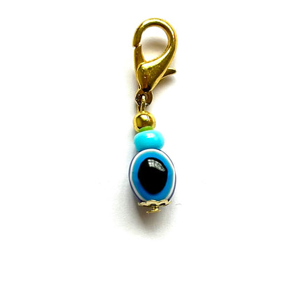 Oval Evil Eye good luck charm on a white background